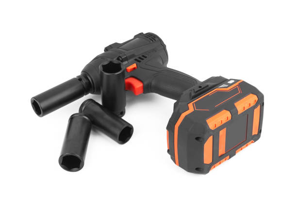 A cordless impact wrench removing a lug nut